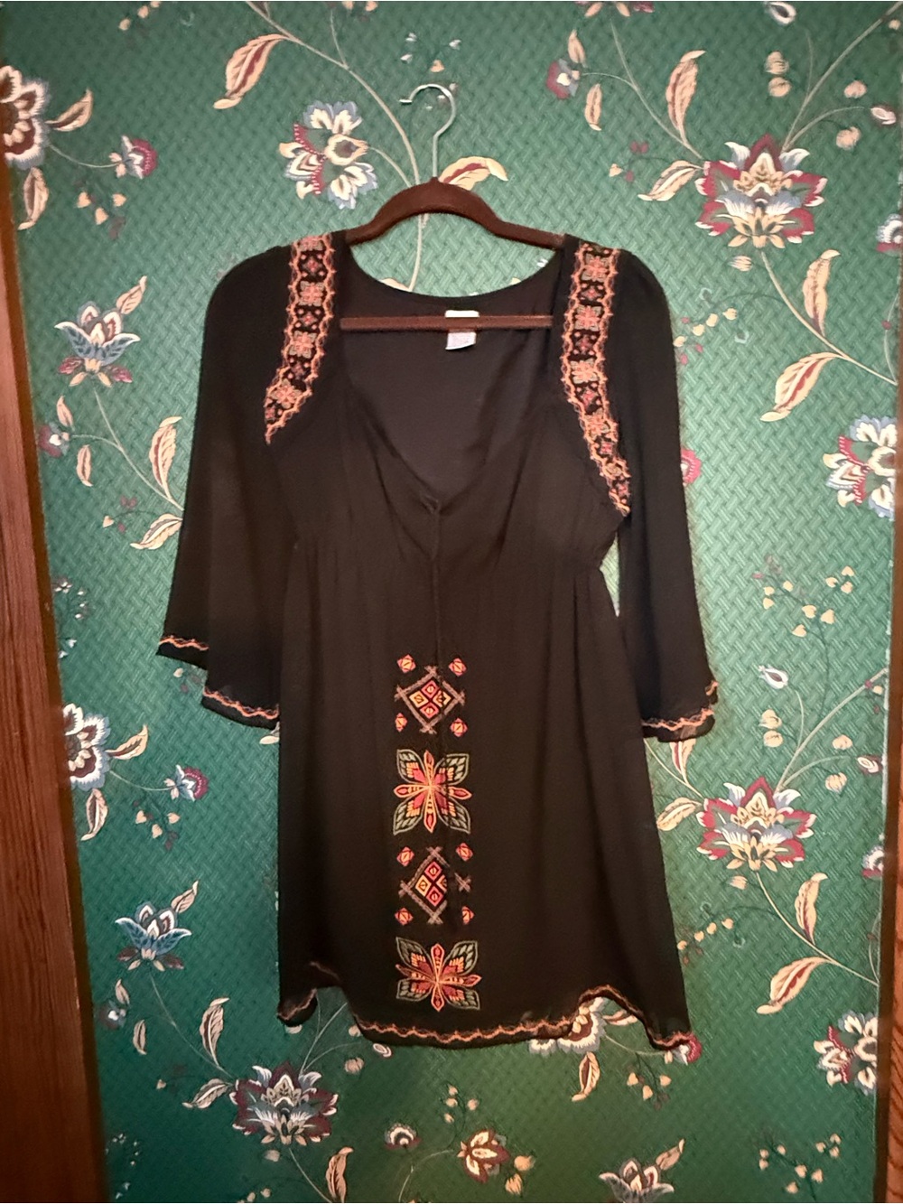 Charming Charlie Black Top with Brown Hanger Detail
